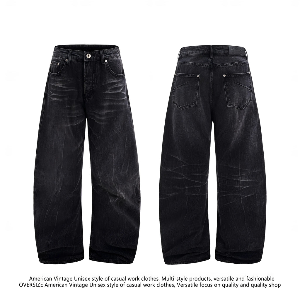 Men's black American washed straight leg jeans with old lightning crack detailing on a plain background
