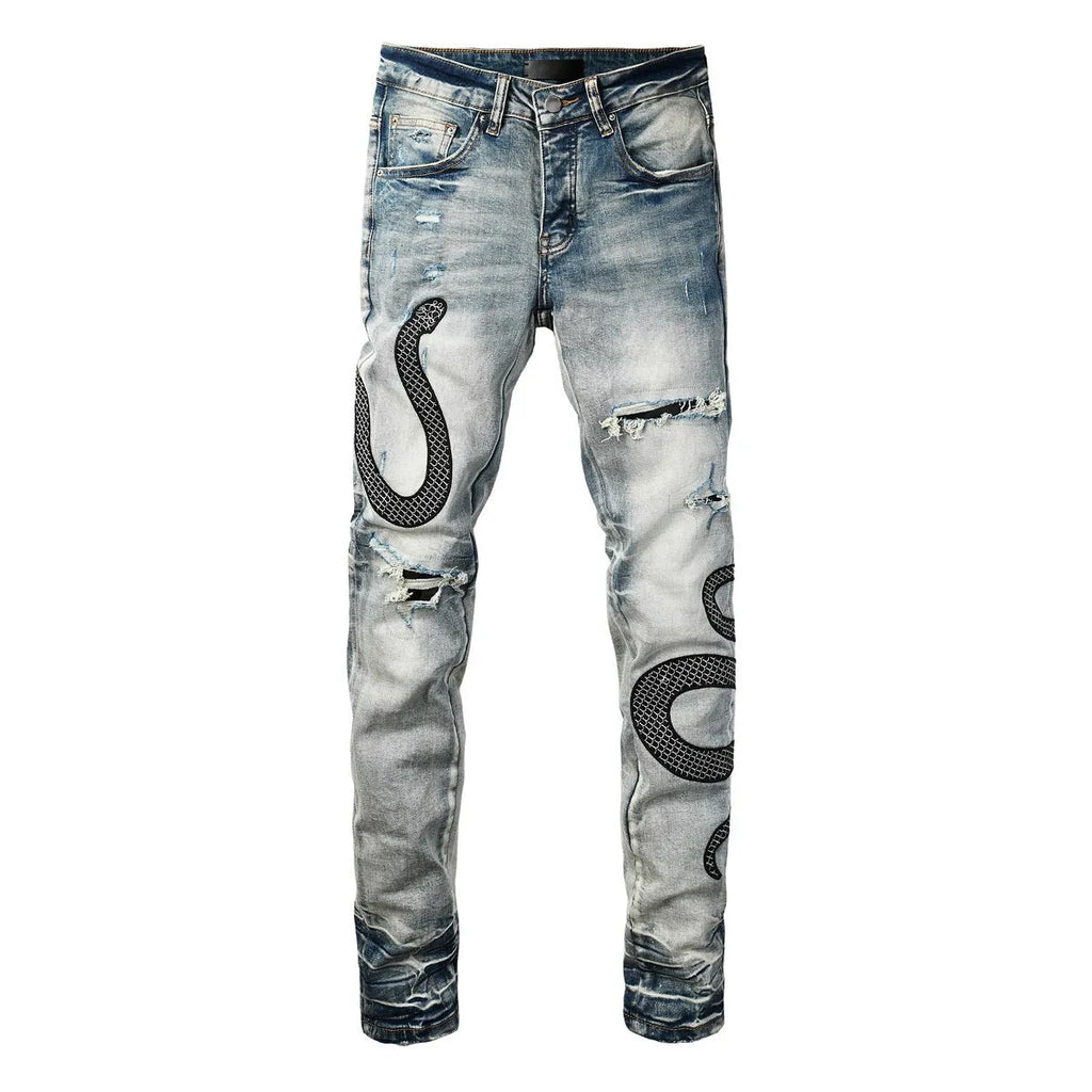 Blue distressed street fashion skinny jeans with a button fly and tight leg fit.