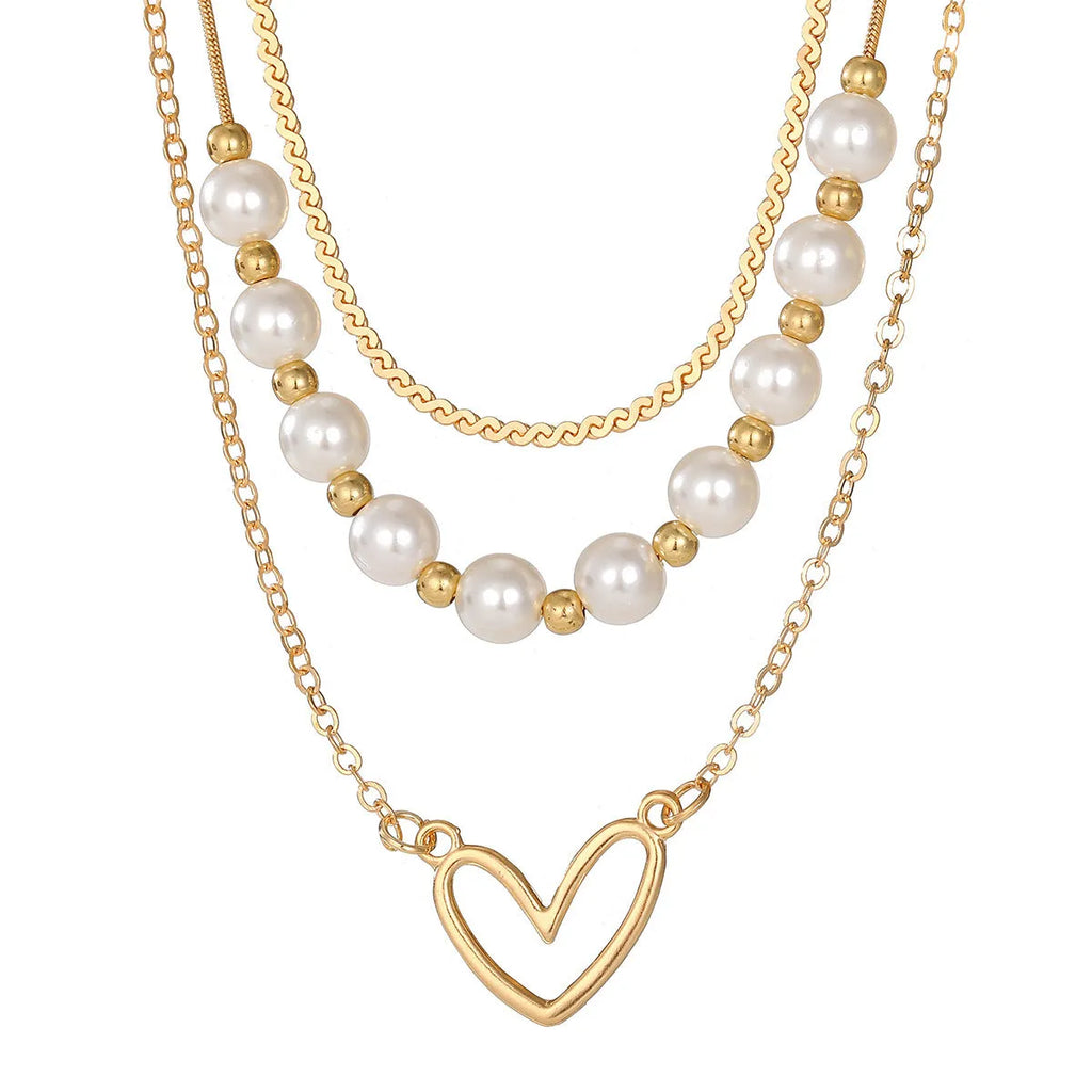 Vintage gold tone necklace with heart pendant on pearl chain, adjustable 41-50cm length