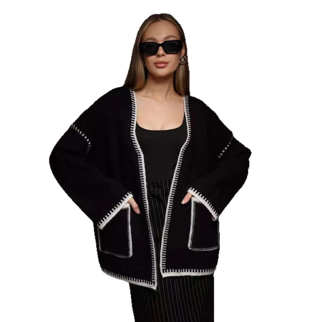 Lace-up front knitted cardigan in black, camel, or white, showing loose fit and thick fabric.