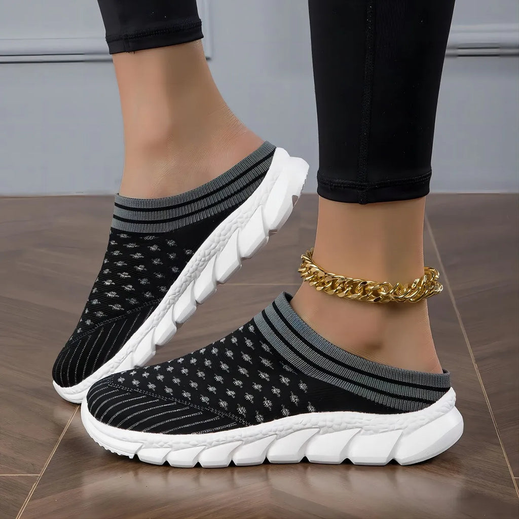 Women's black, pink, and purple Flyknit semi-slipper shoes with striped pattern and hollowed-out design.