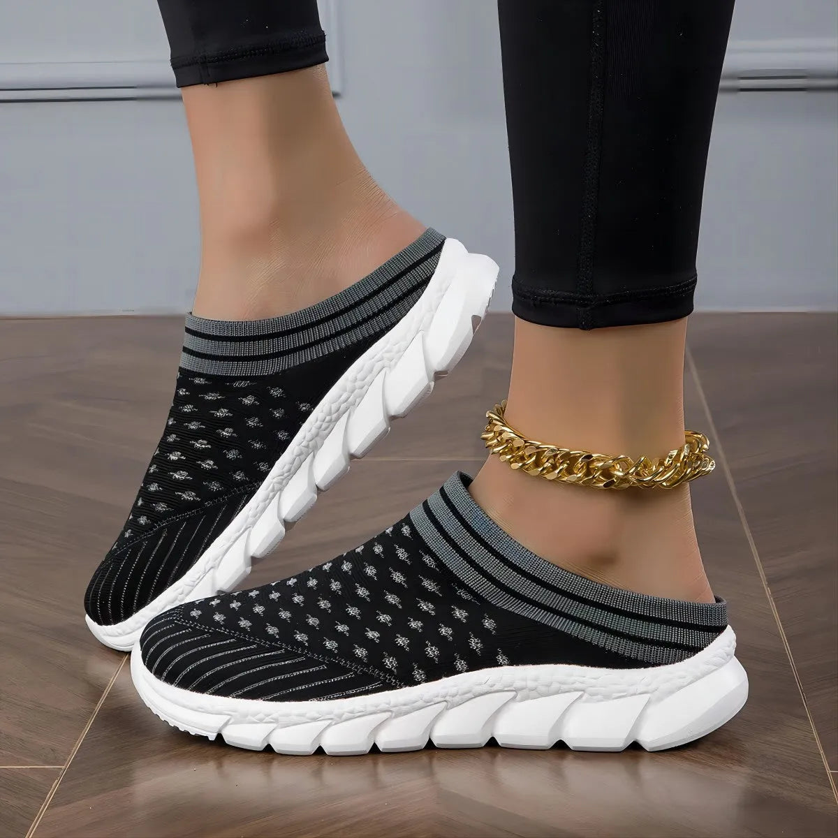 Women's black, pink, and purple Flyknit semi-slipper shoes with striped pattern and hollowed-out design.