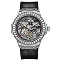 Men's automatic wristwatch with hollow dial showing mechanics, diamond studs on white case, on a black strap.