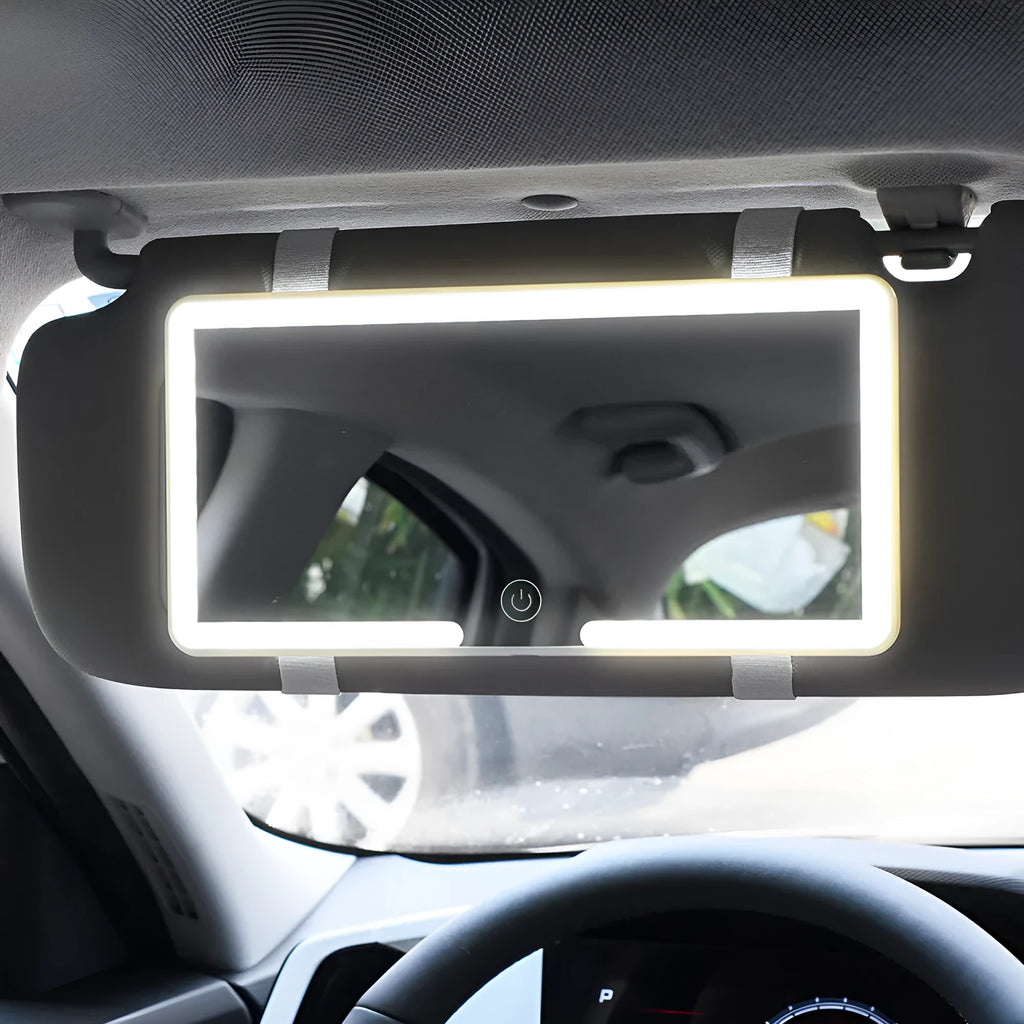 Black automotive sun visor makeup mirror with LED light and dimming control, shown with data cable