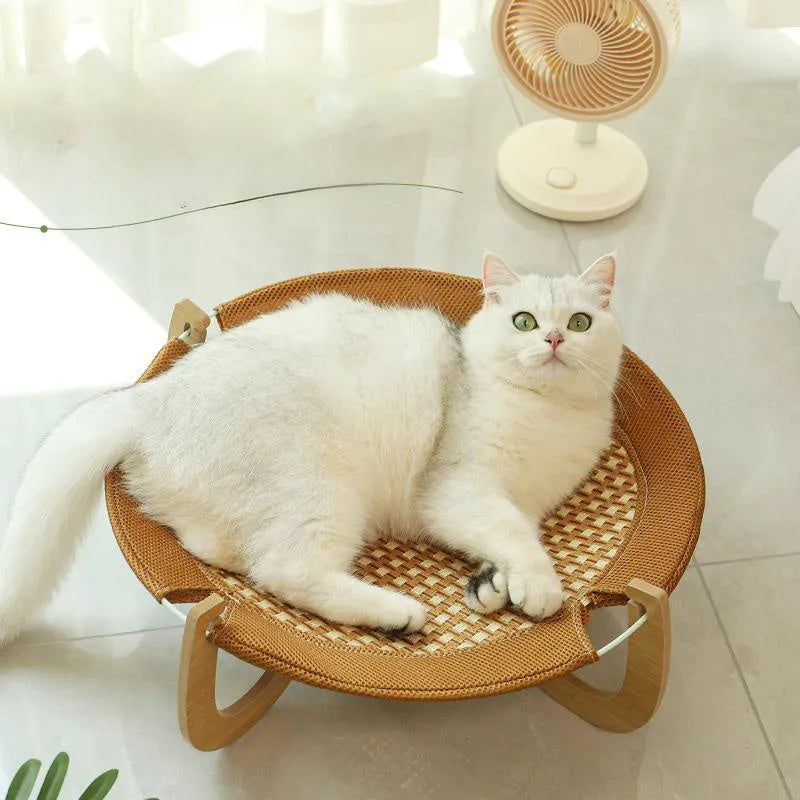 Brown woven rattan pet hammock bed raised off the ground
