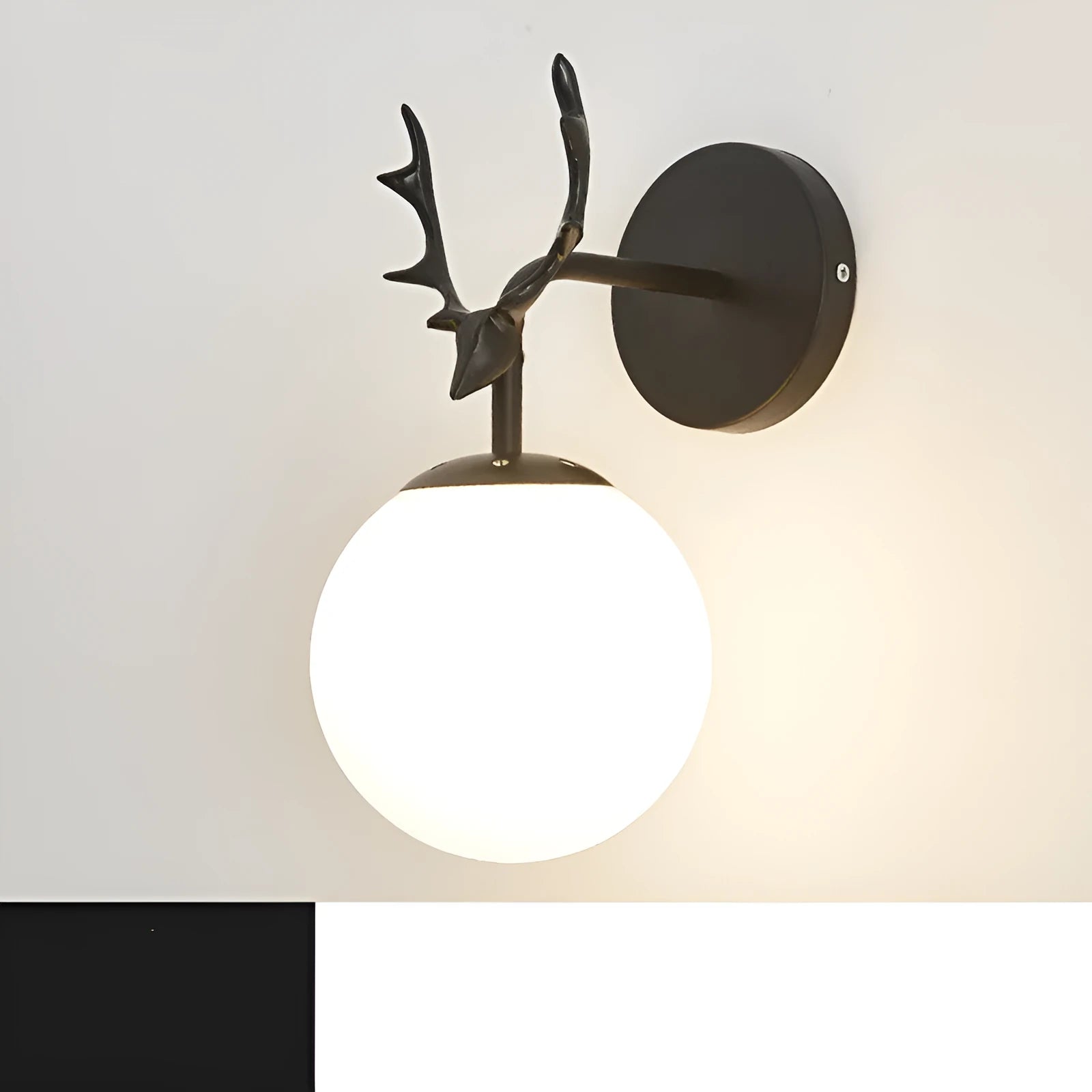 Modern round glass wall sconce with a Nordic design, mounted on a white wall, showing its light-diffusing shade and compact 30cm diameter.