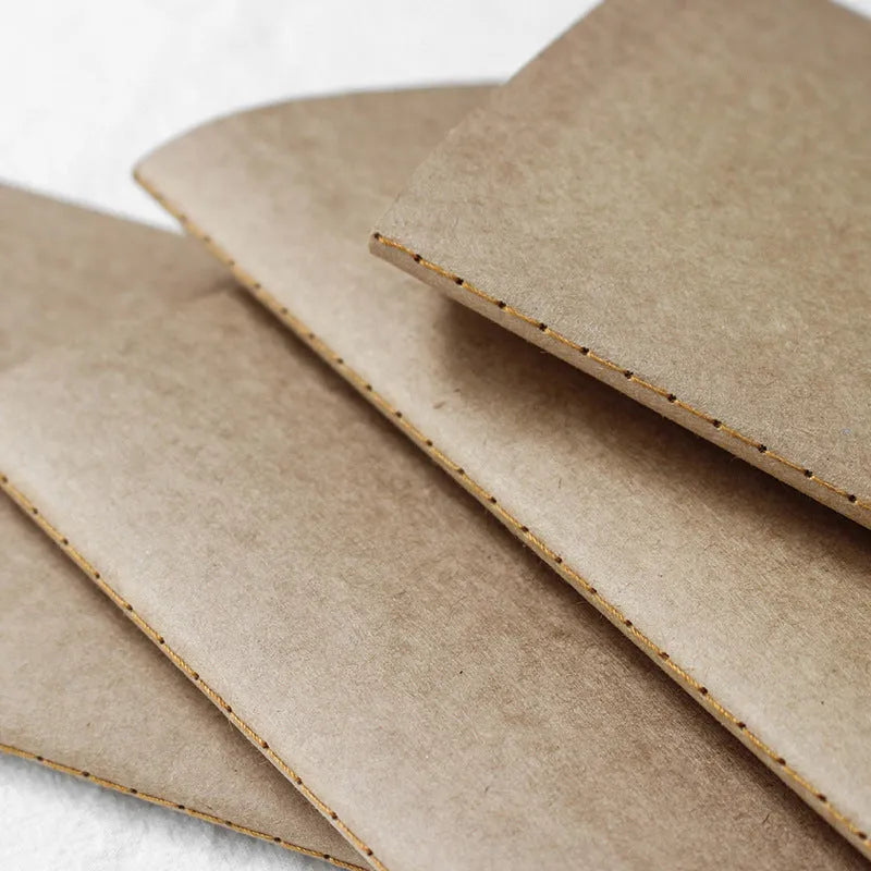 Diary refill inner core showing saddle stitch binding and 11x21cm dimensions