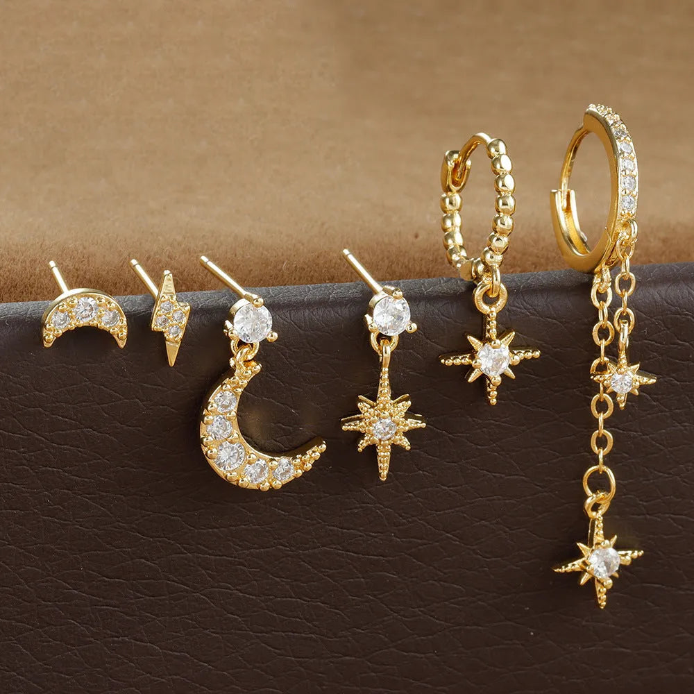 XINGX six-pair gold chain tassel earrings set with zircon studs on jewellery display