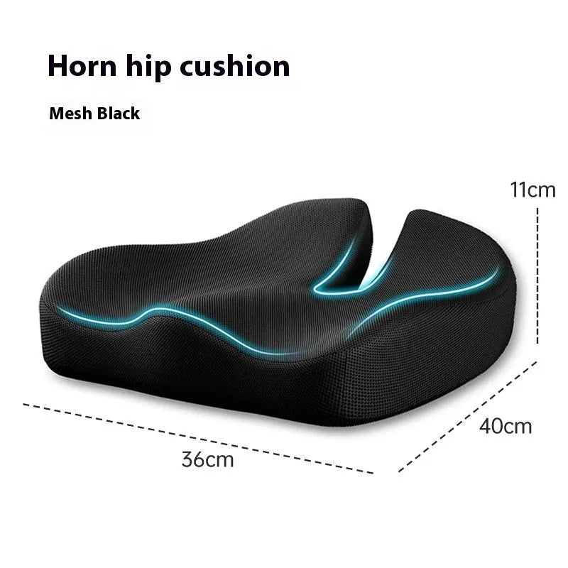 Dark grey memory foam office chair cushion for lumbar support on a desk chair.