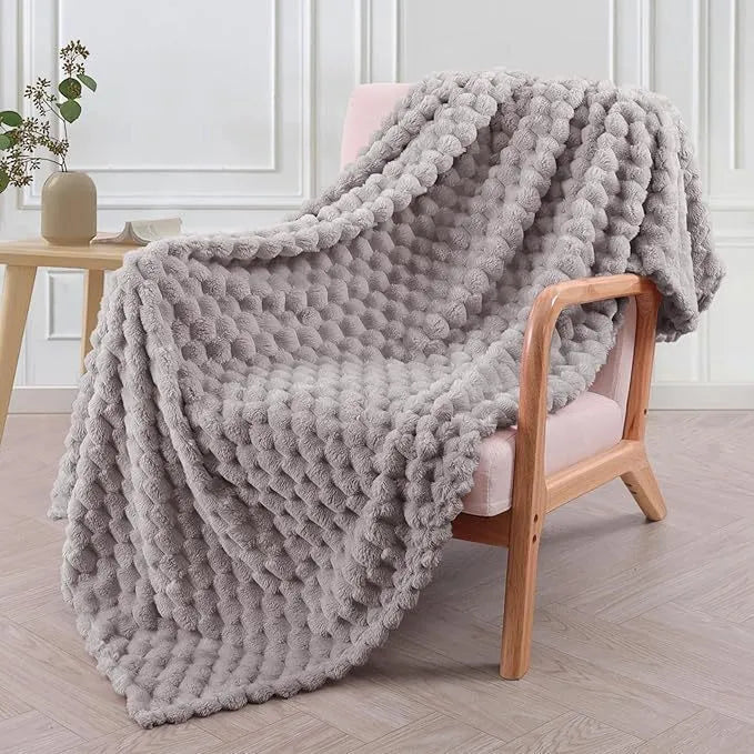 Children's soft plaid polyester blanket shown in camel colour, suitable for nap time.