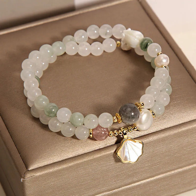Women's Tianshan emerald green crystal bracelet with gold-plated apricot leaf pendant and rhinestones.