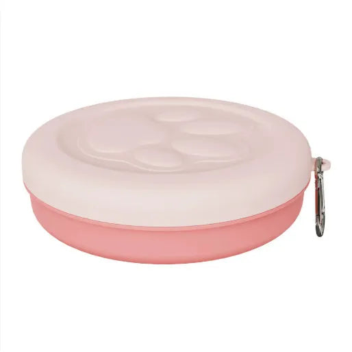 Portable dual-colour dog bowl set with attached snack box in light green and pink.