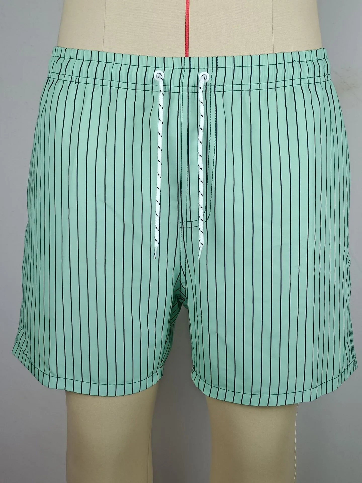 Striped polyester fibre beach shorts with triangle lining in navy blue, straight leg design