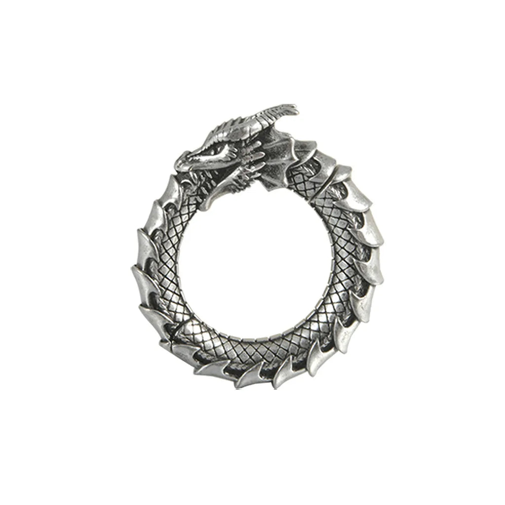 Retro geometric dragon silhouette earrings in antique silver, showing hollow-out design and large size.