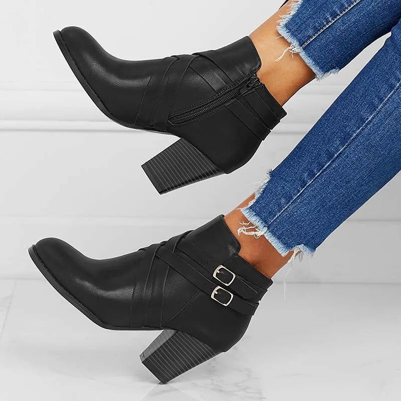 Plus size black short boot with side zipper, belt buckle, and a 7cm rubber heel