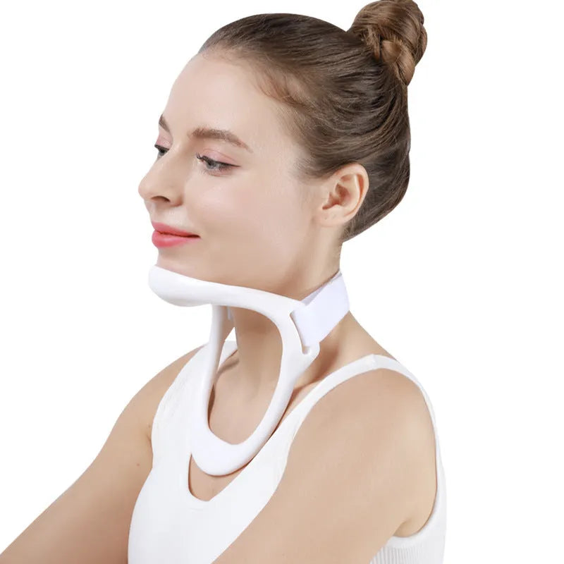 White PP plastic neck brace for cervical spine support shown on a grey background.