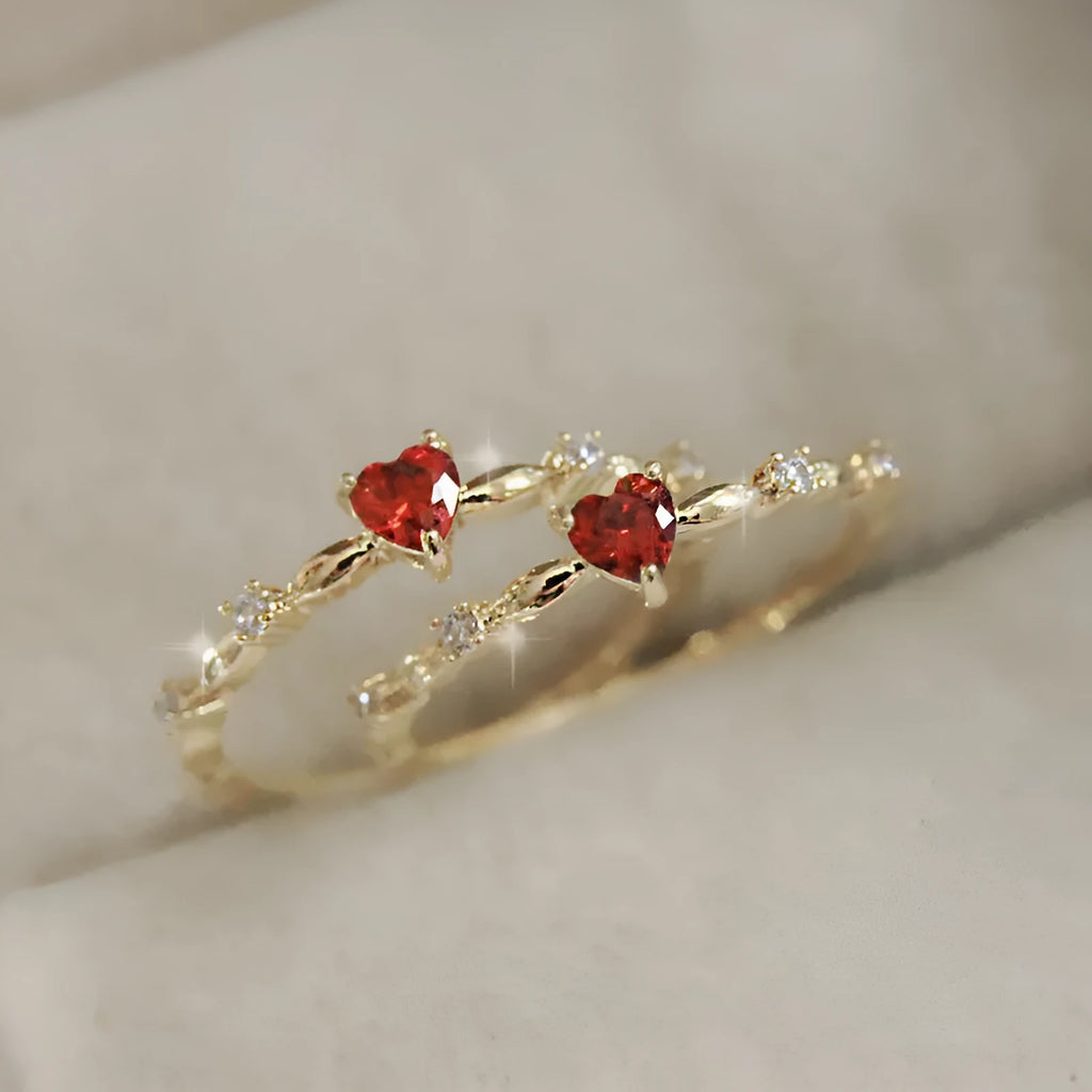 Personalised gold or silver plated ring with a peach heart charm and clear zircon stones.