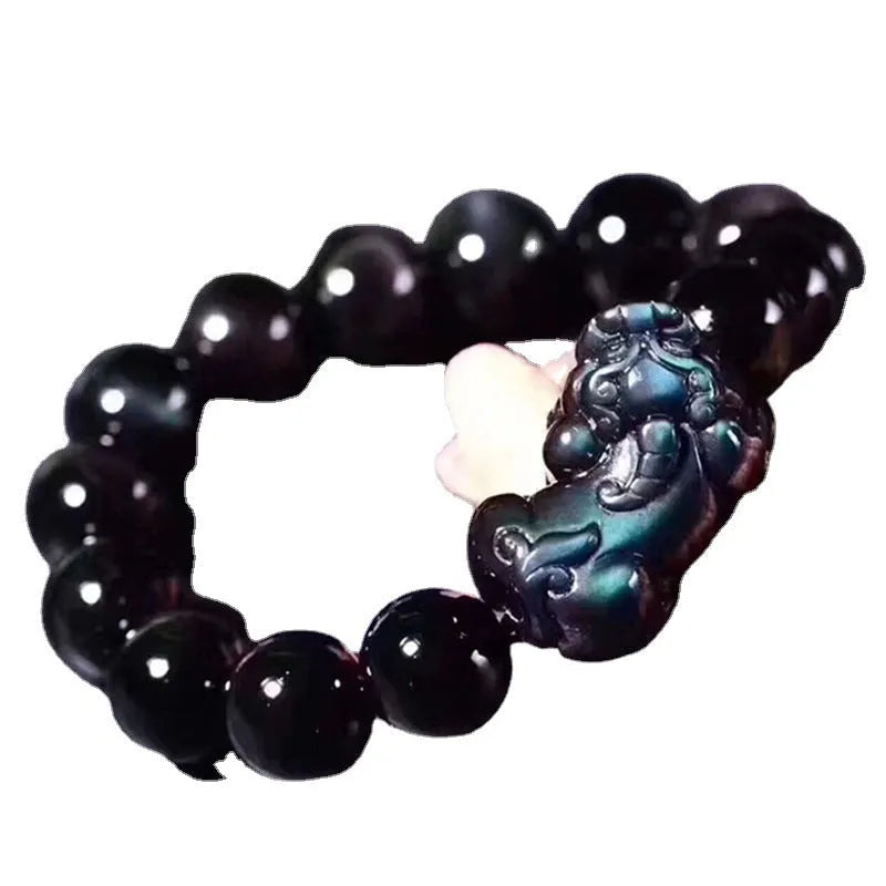 Natural ice colour eye obsidian crystal bracelet with spherical beads on a string.