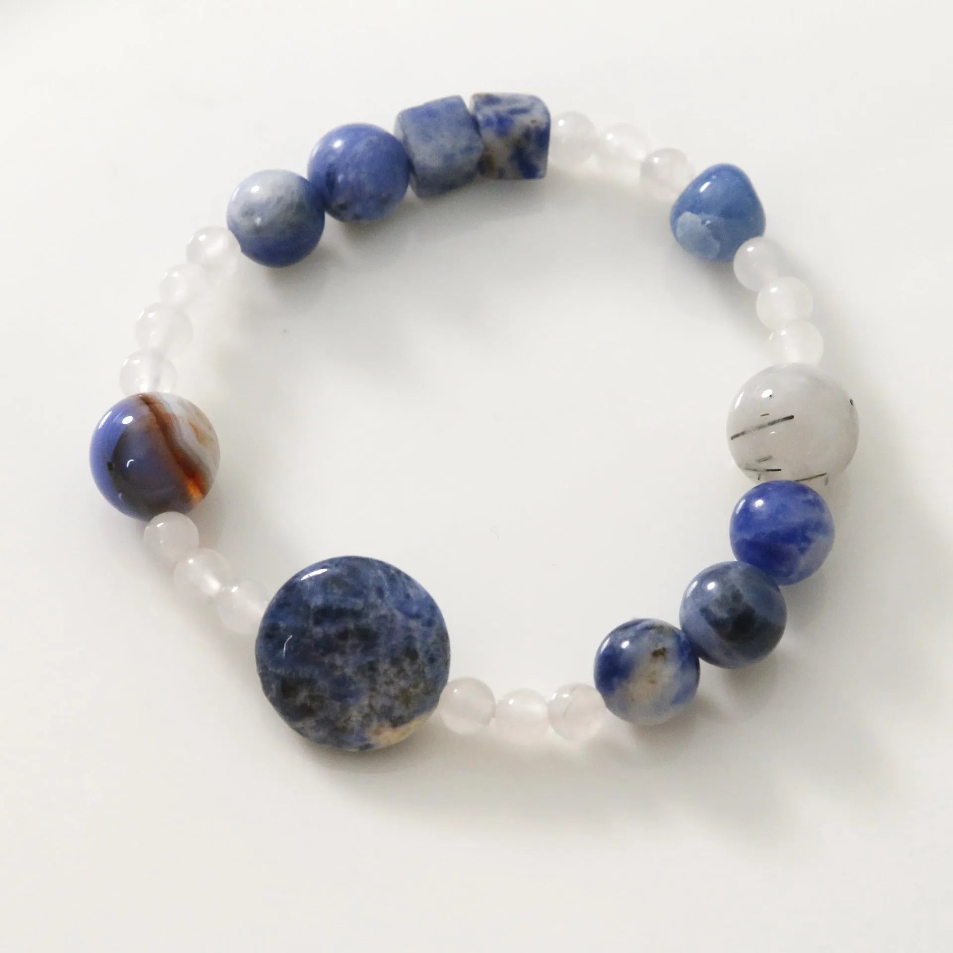 Hand-woven natural stone bracelet with blue point and black hair crystal agate beads