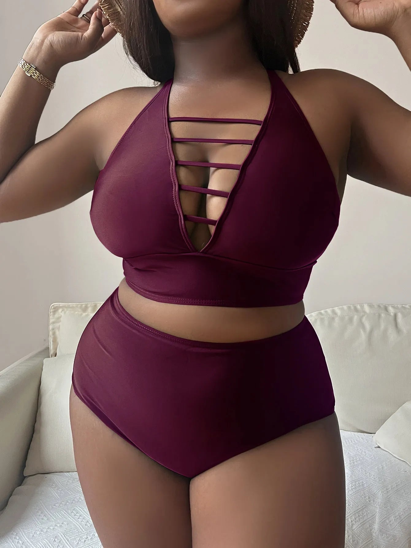 Plus size women's halter bikini with adjustable cross straps and high-waisted briefs in solid colour