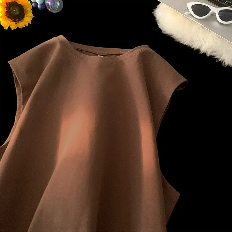 Men's loose solid colour cotton tank top on a hanger, showing straight hem and sleeveless design.