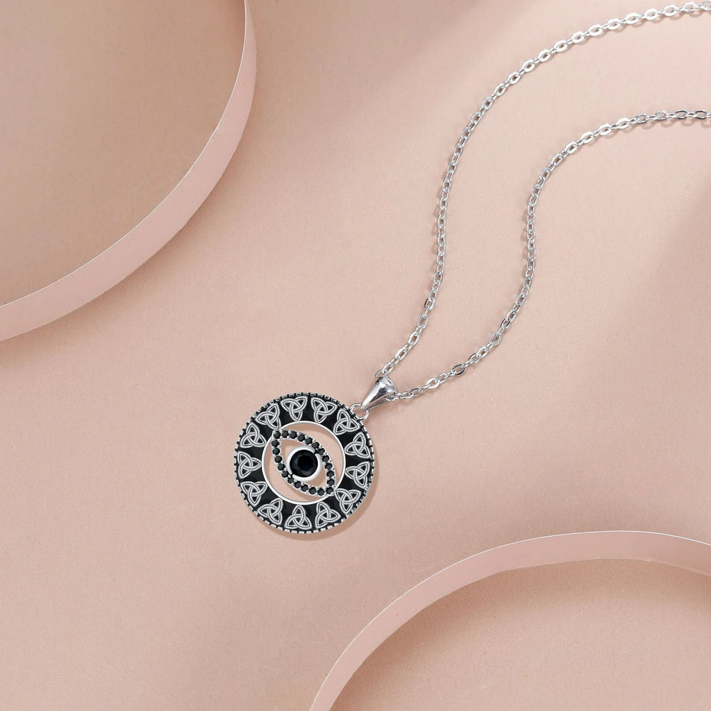 Copper Devil's Eye pendant necklace with electroplated finish on a cross chain for women.