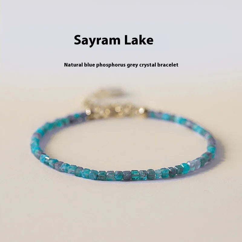 Women's blue apatite crystal bracelet with diamond-shaped beads on an elasticated band.