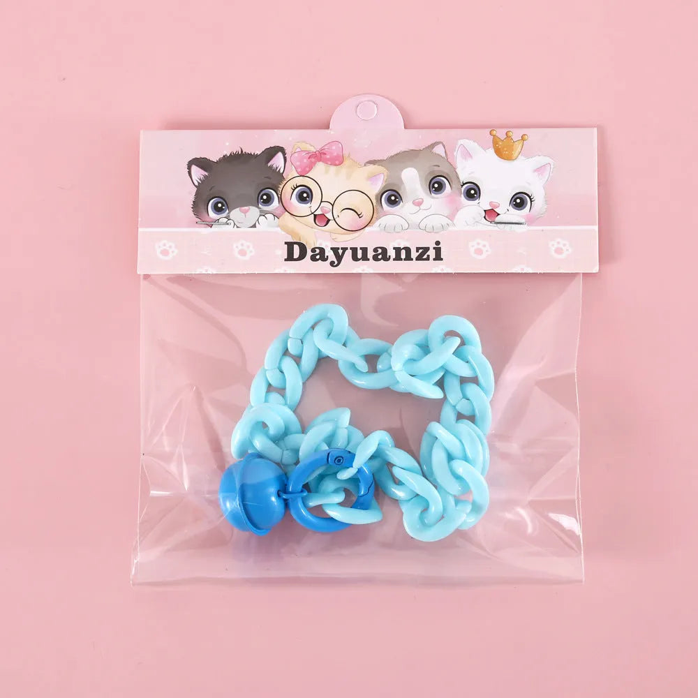 Adjustable plastic pet collar in macaron candy colours with chain detailing, shown with a buckle.