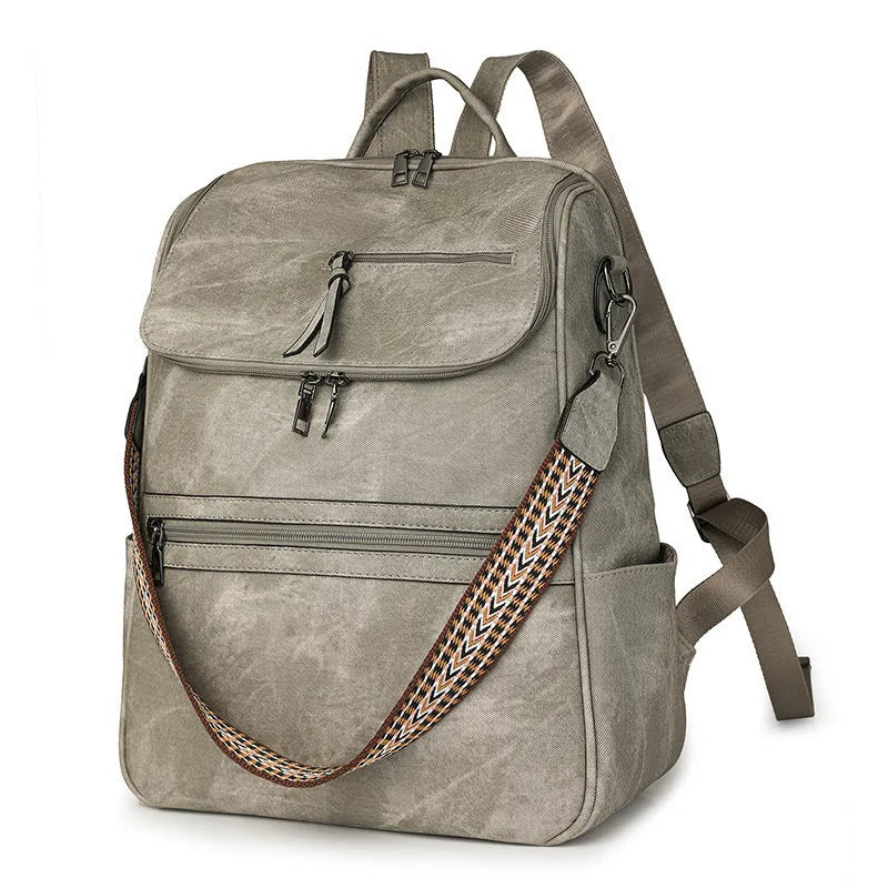 Retro solid colour PU backpack with curved shoulder straps shown in black.