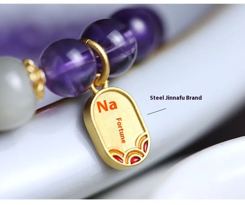 Amethyst colour crystal bead bracelet with 8mm round beads in a geometric national style design.