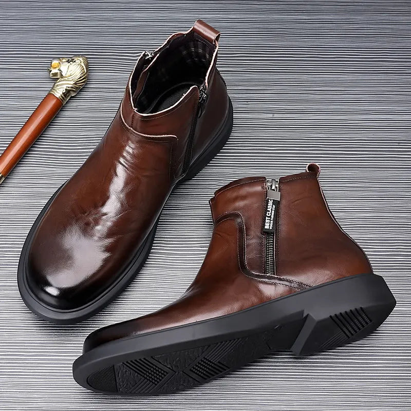 Men's brown and black genuine leather Chelsea boots with side zipper, mesh lining, low heel, and rubber sole.