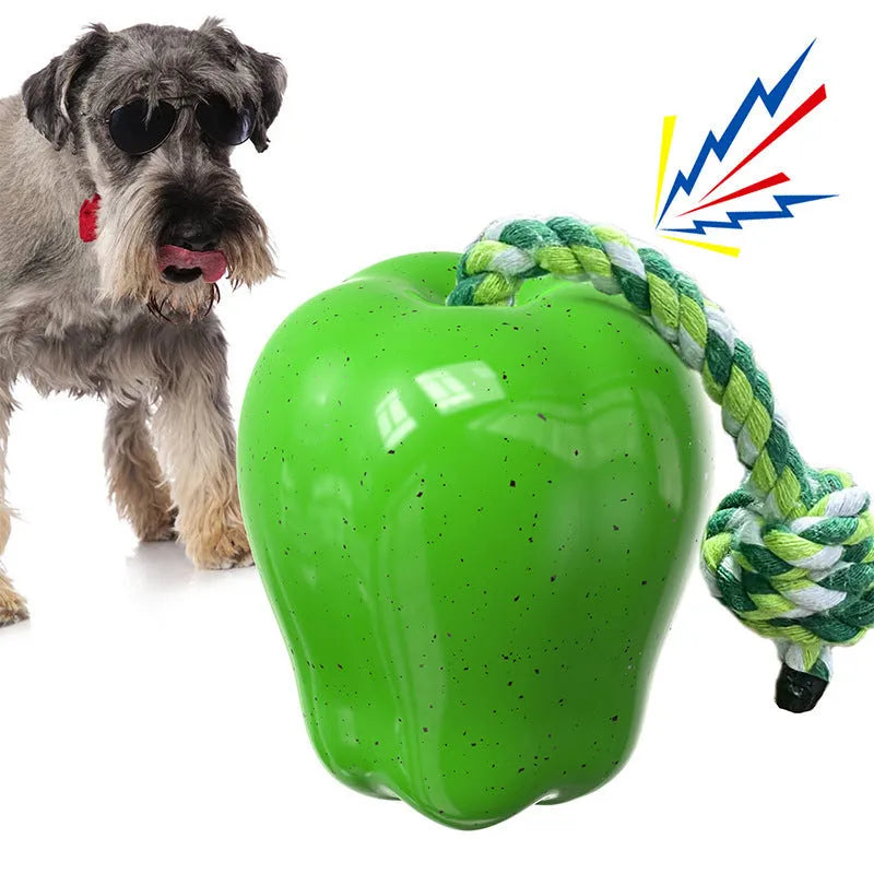 Plastic dog molar toy with food dropping ball in green apple colour for outdoor enrichment
