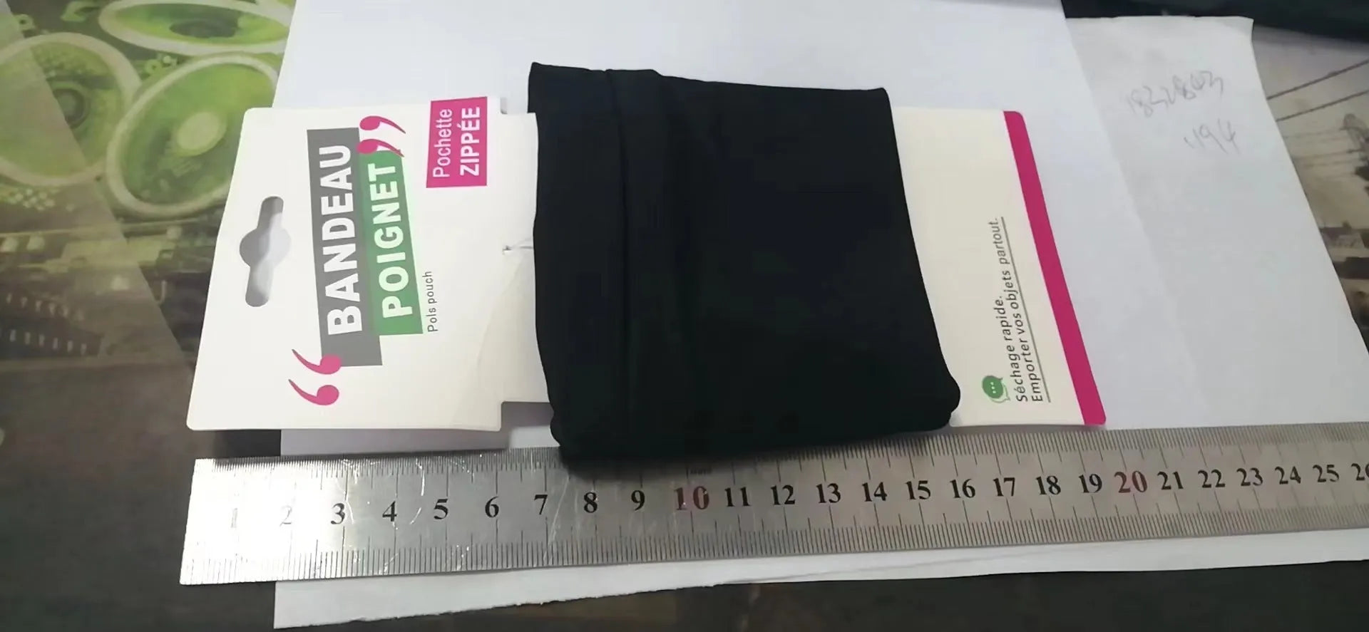 Adjustable fitness wrist bag with armband sleeve for mobile phone, shown in packaging.