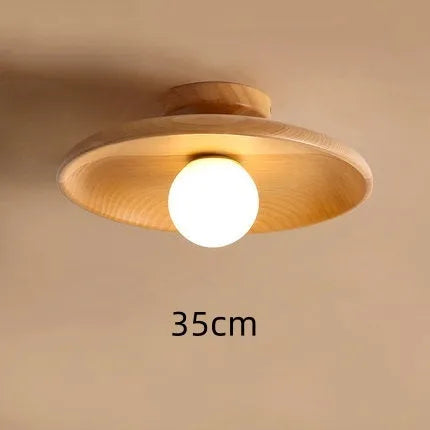 Solid wood modern minimalist ceiling lamp with glass shade in three sizes.