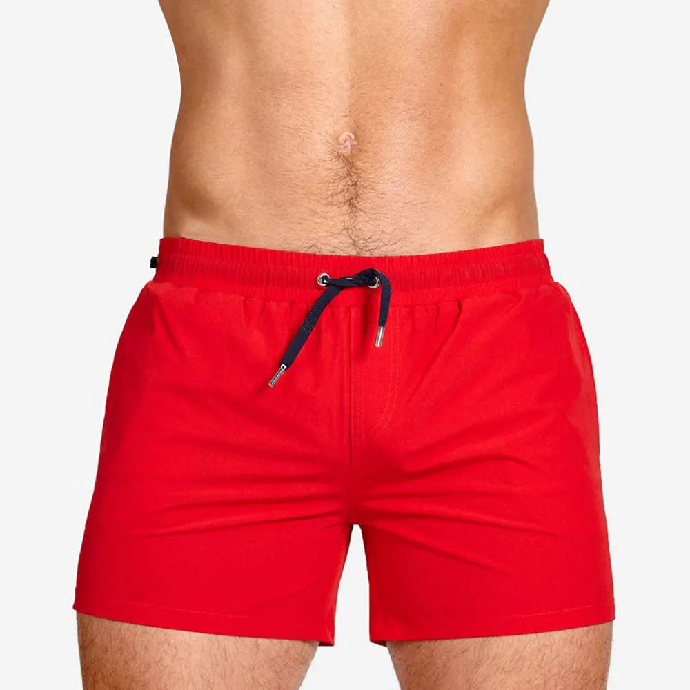 Polyester mesh-lined sports shorts in solid colours for swimming and fitness.