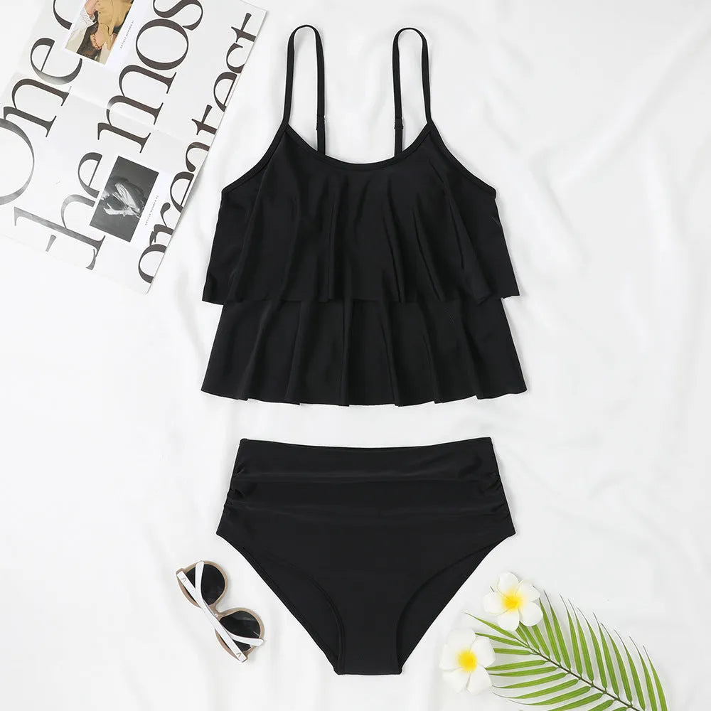 High waisted black and coconut tree print swimsuit top and bottom on a mannequin