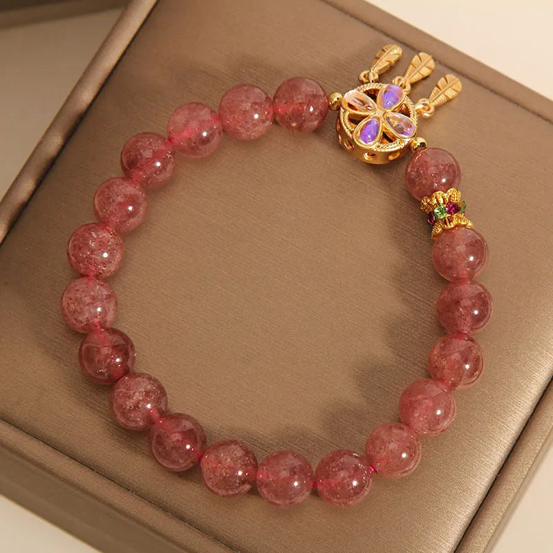 Women's strawberry quartz bracelet with dream catcher pendant and four-leaf clover charm in natural pink crystal