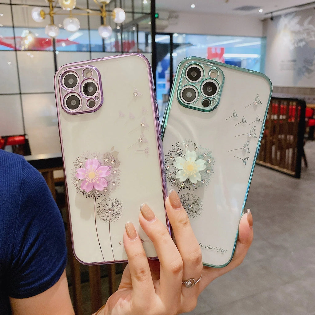 Green iPhone case with 3D floral design and extended kickstand on a table