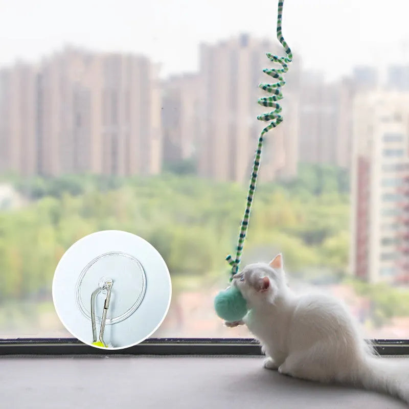 Spring cat toy with bell stick, inflatable ball, and suction cup mount in multiple colour options