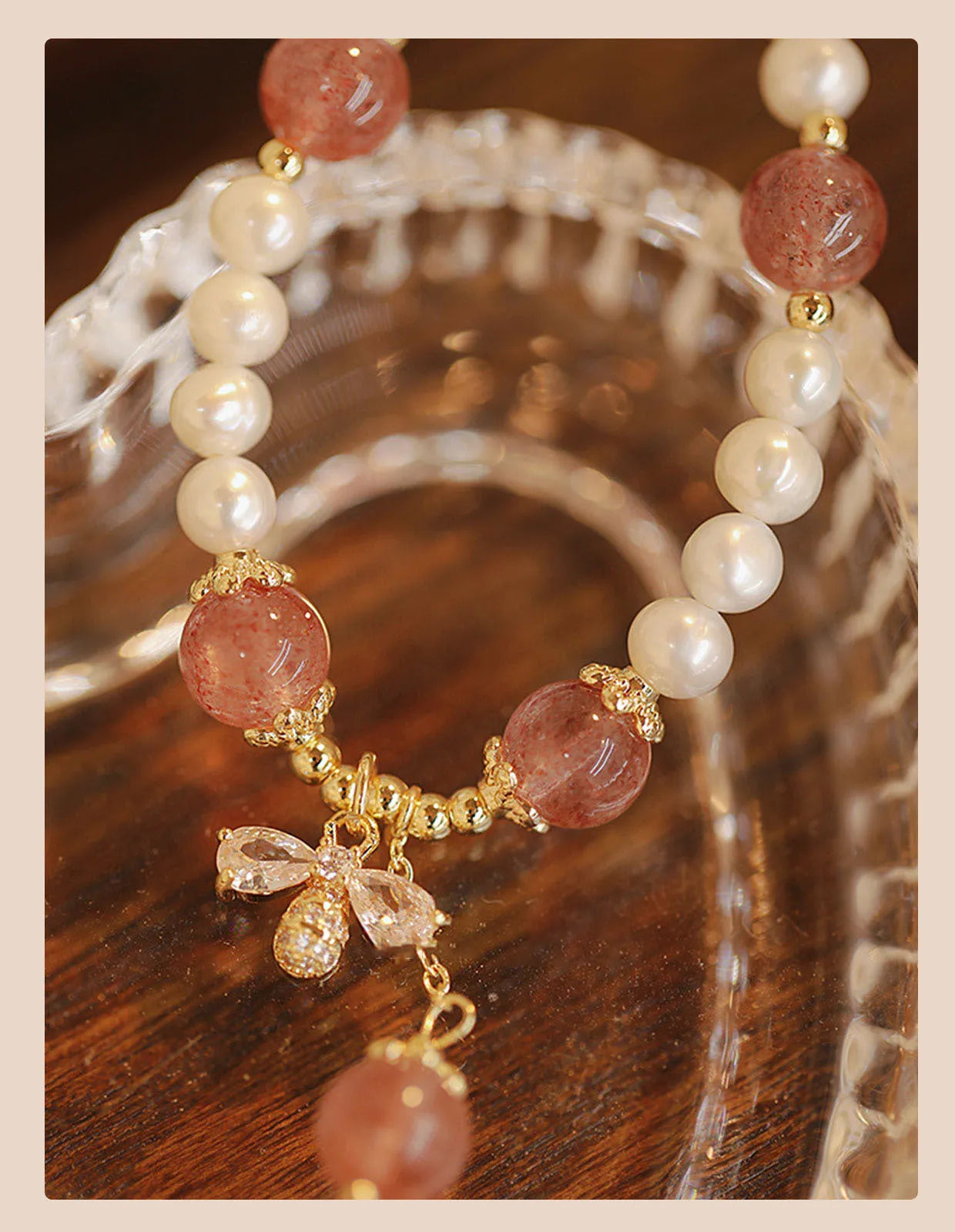 Strawberry quartz crystal bead bracelet for women with a central bow decoration.