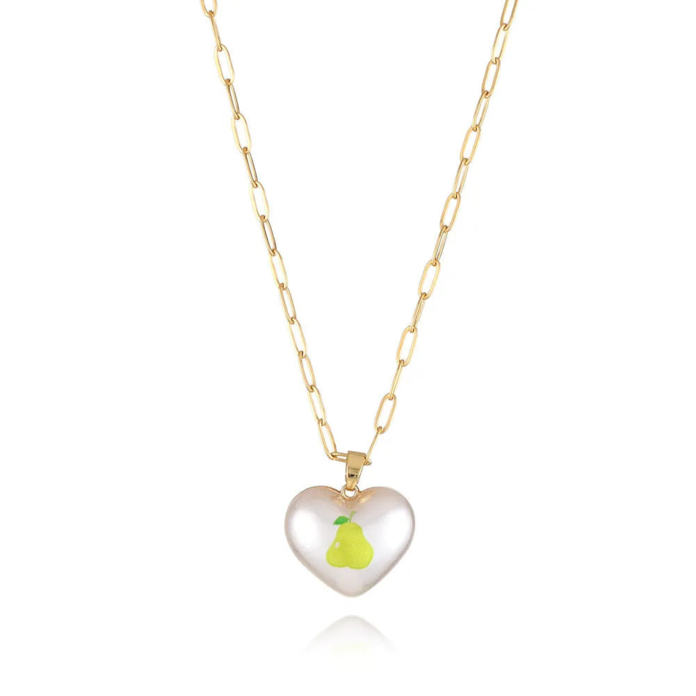 Heart-shaped necklace with fruit pendant on geometric chain showing strawberry pineapple apple pear cherry options