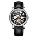 Men's tourbillon mechanical watch with luminous hands on a steel bracelet, showing a black dial.