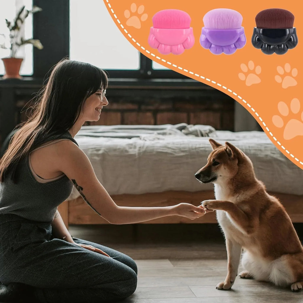 Three pet paw-shaped balm brushes with soft fibre heads in storage boxes