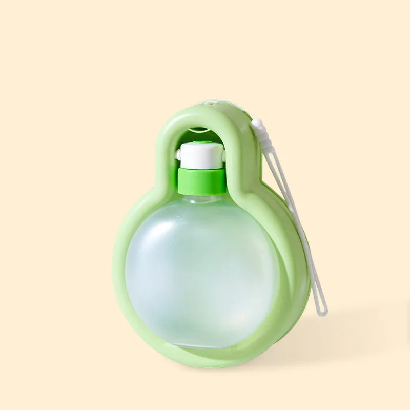 Green portable dog water bottle with fold-out drinking bowl for travel.