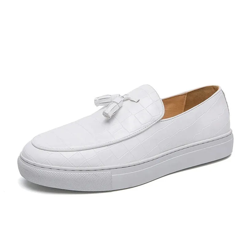 Men's brown tassel sneakers with round toe and rubber sole on a white background.