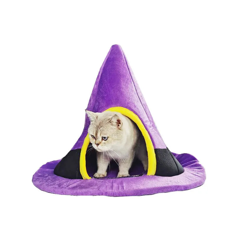 Purple cloth Halloween witch hat shaped cat bed measuring 60 by 45 centimetres.