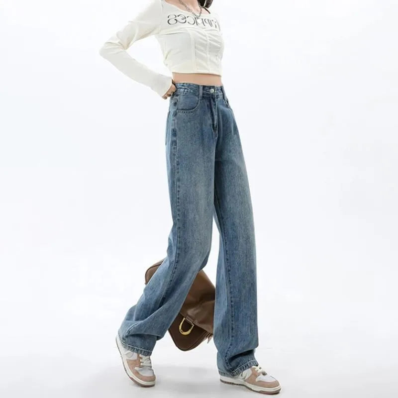 Woman wearing retro blue high-waisted wide-leg denim jeans with a straight-leg cut.
