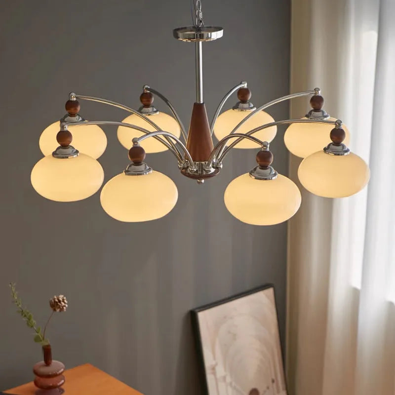 Persimmon glass and chrome chandelier with multiple glass lampshades in a choice of colours.