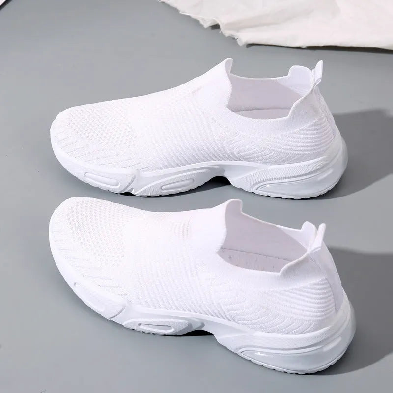 Lightweight black slip-on sock shoes with a low-top design and textured PVC sole.