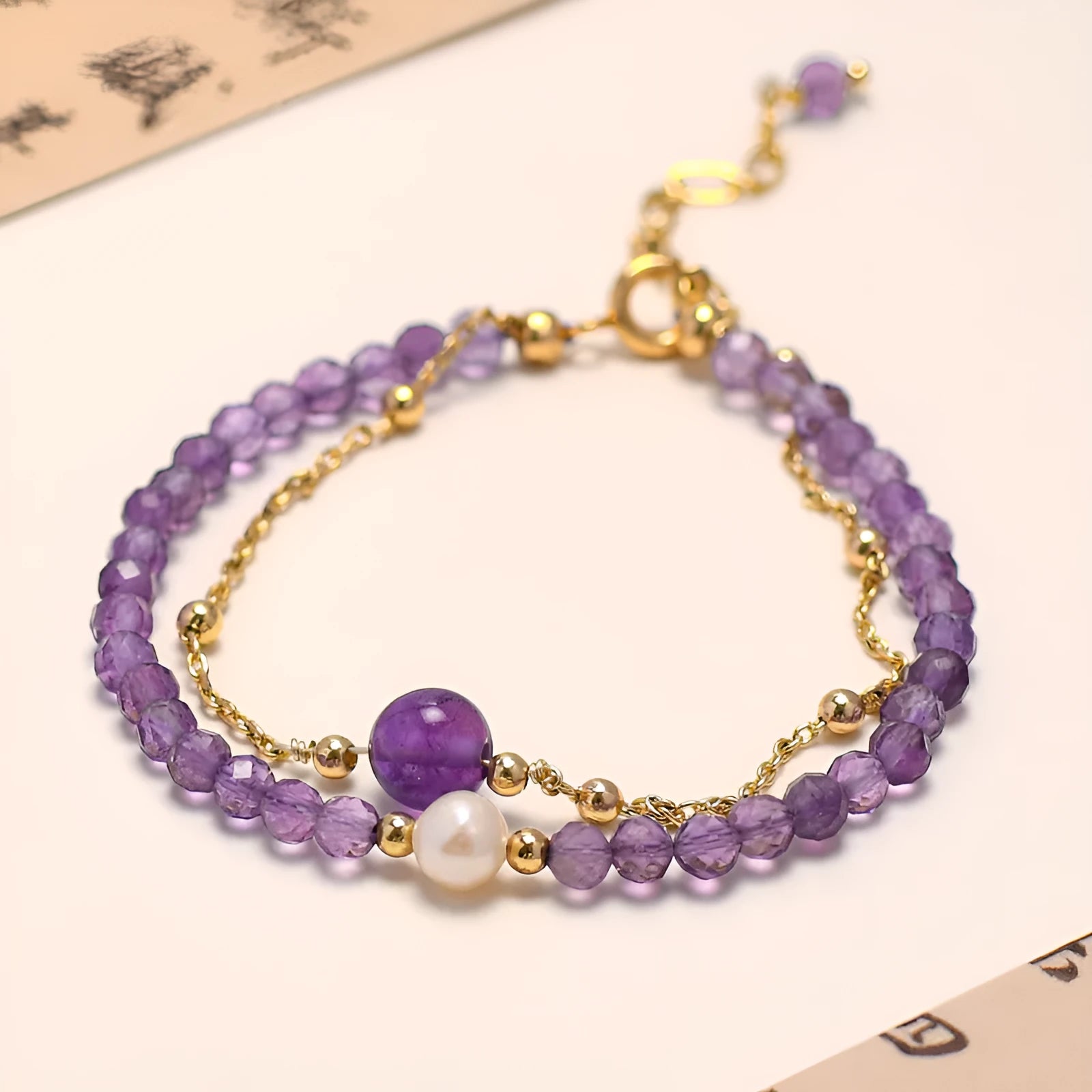 Chinese style women's bracelet with diamond-shaped amethyst crystal beads and electroplated metal clasp